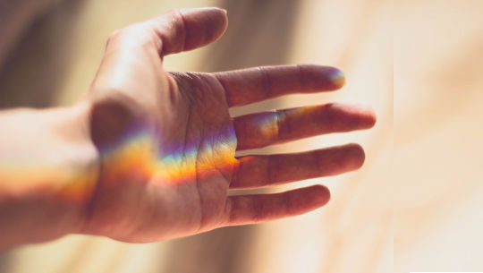 Finding Silver Linings and Rainbows a rainbow in the palm of an open hand